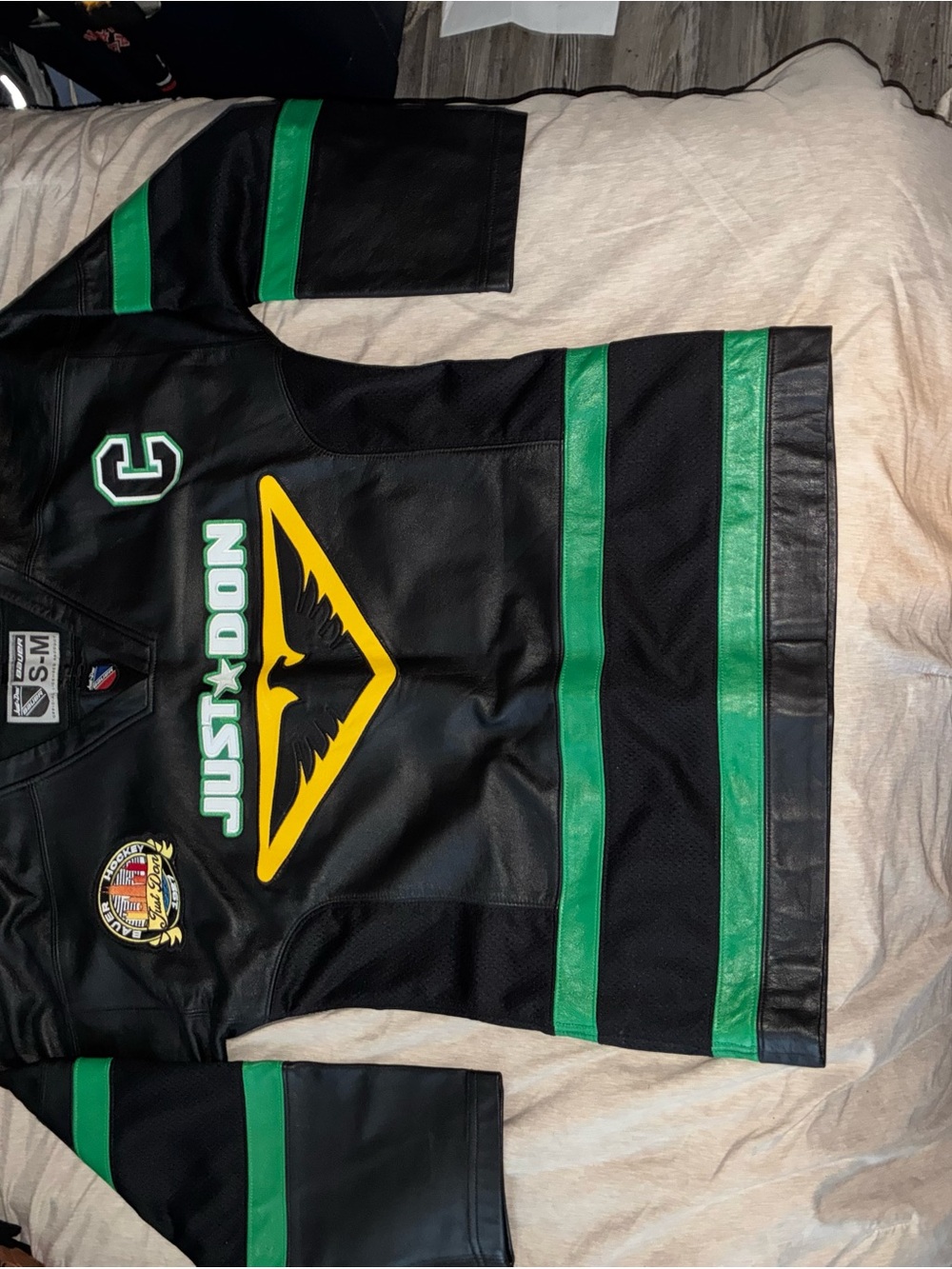 Just Don Black Leather Hockey Jersey with Green and Yellow Accents